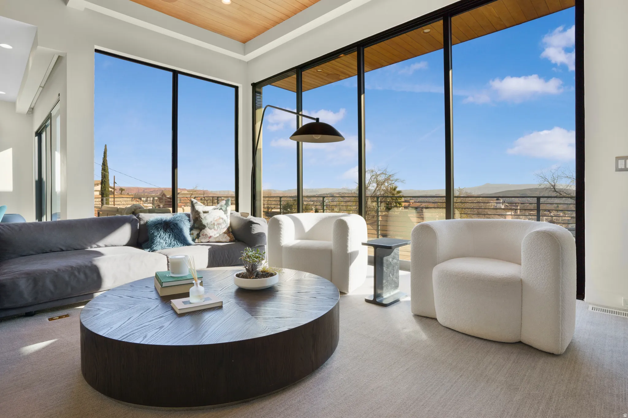Living area featuring wood ceiling and carpet