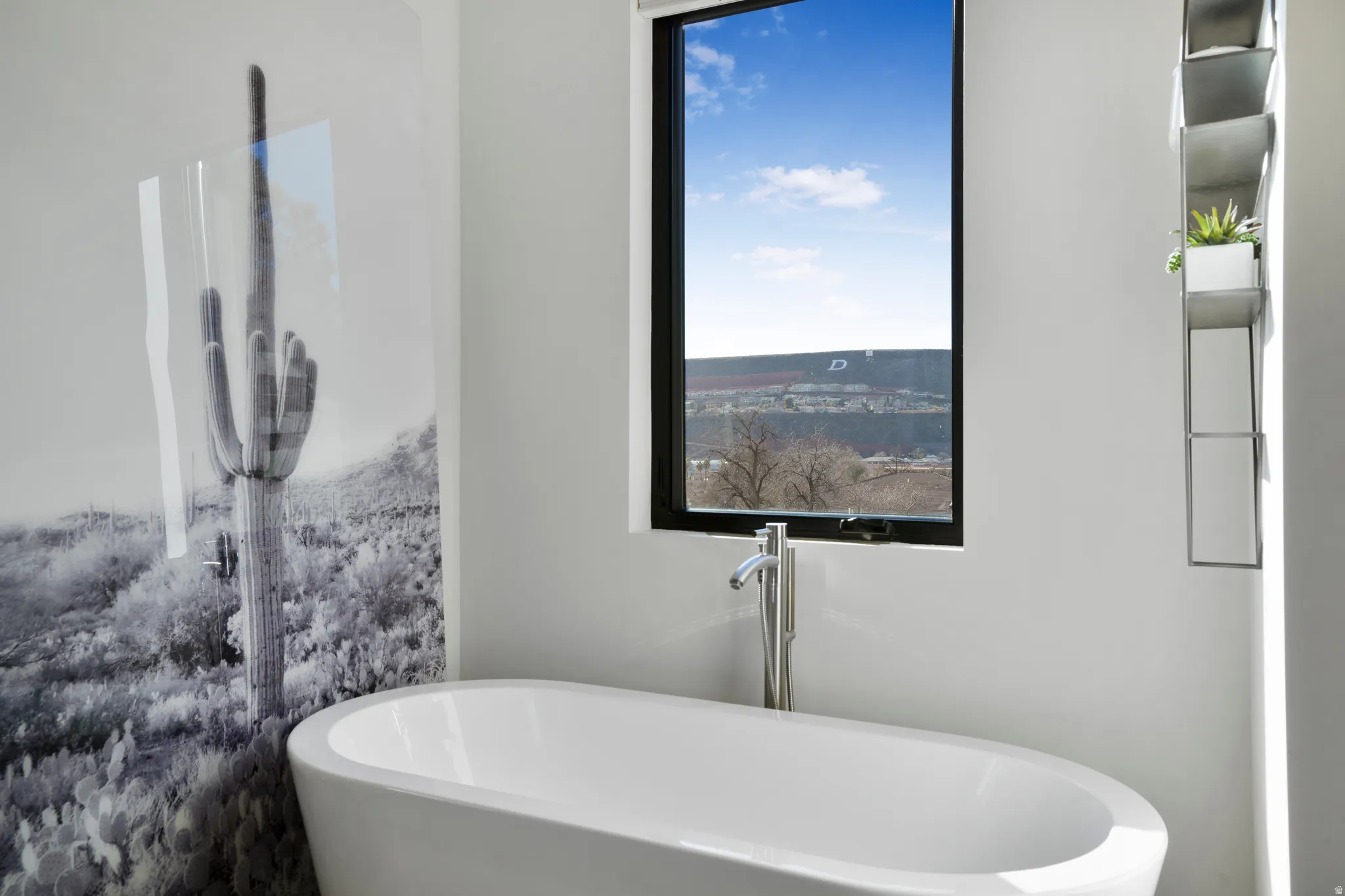 Bathroom with a soaking tub and plenty of natural light