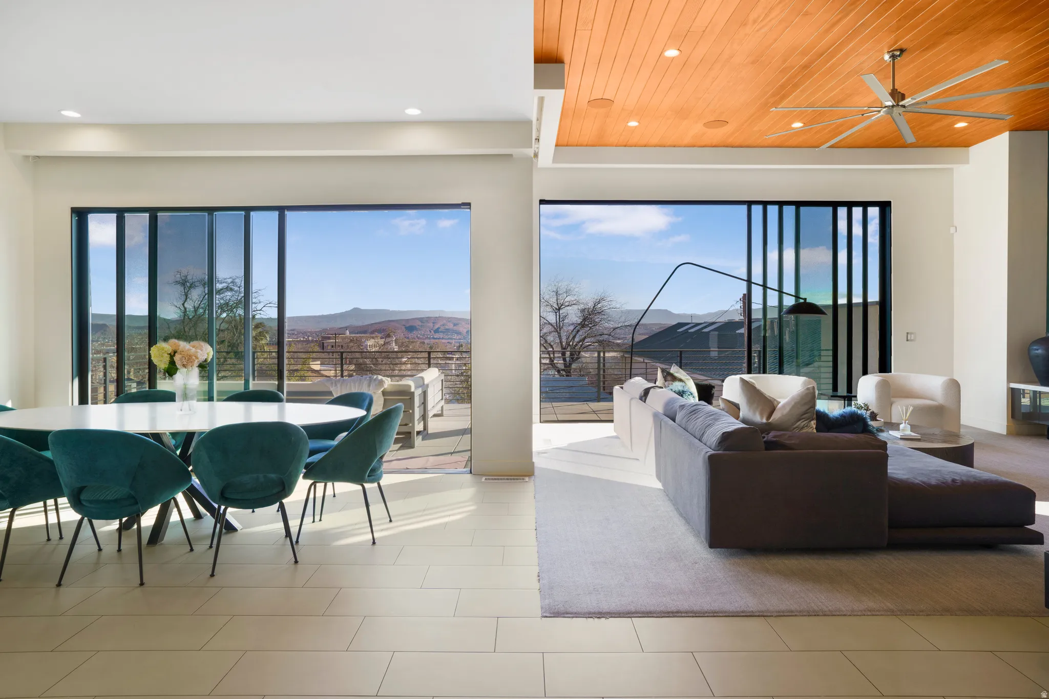 Living area with a mountain view, a ceiling fan, recessed lighting, and wood ceiling