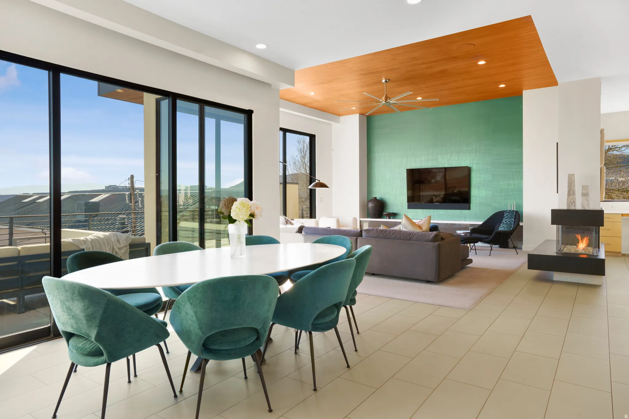 Dining space featuring plenty of natural light, recessed lighting, a ceiling fan, and a fireplace