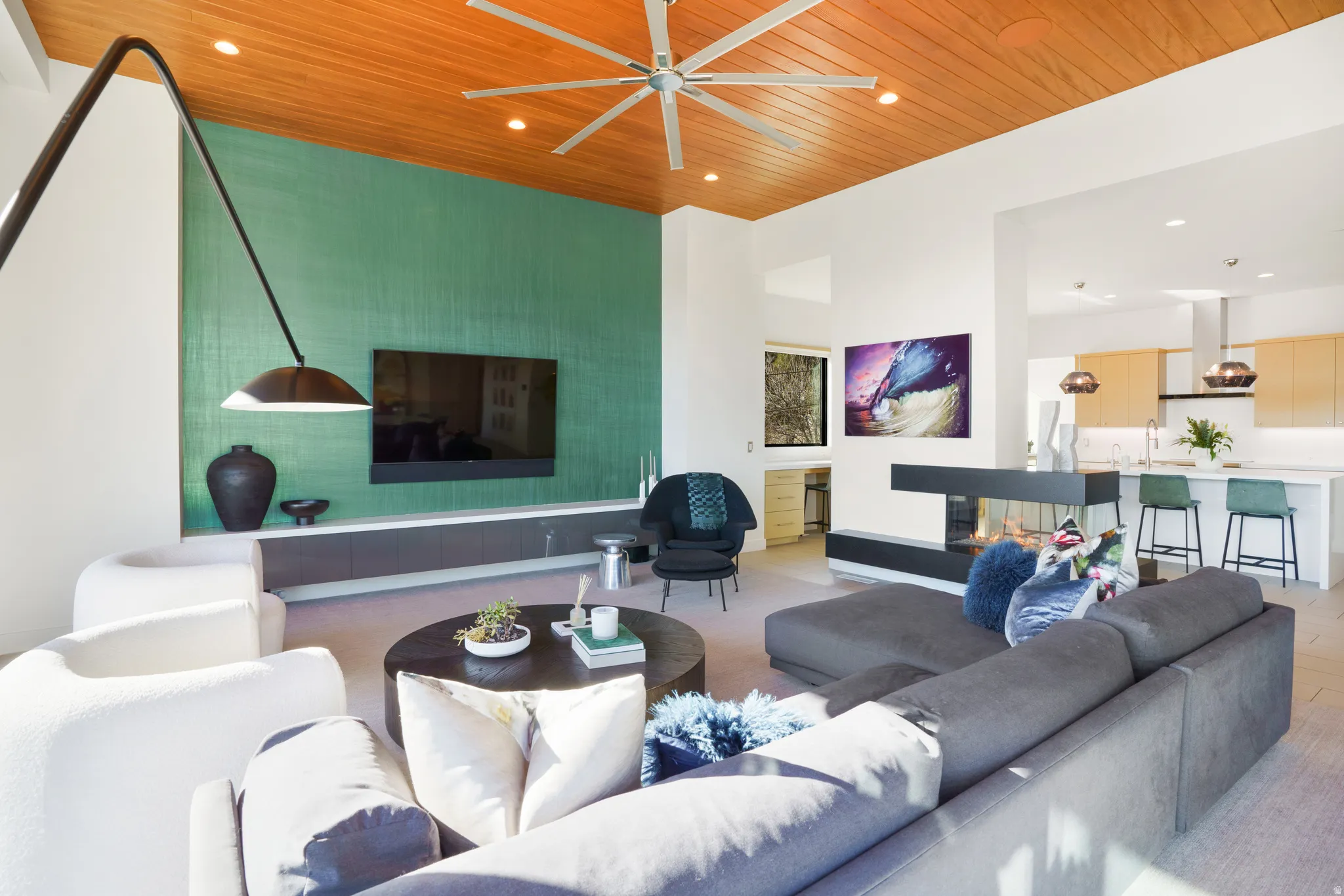 Living area featuring a high wooden ceiling, recessed lighting, and a ceiling fan