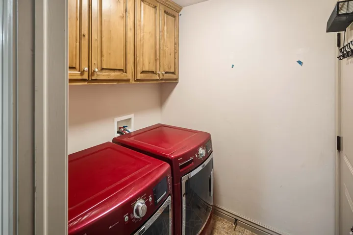 Laundry area with washing machine and dryer and cabinet space