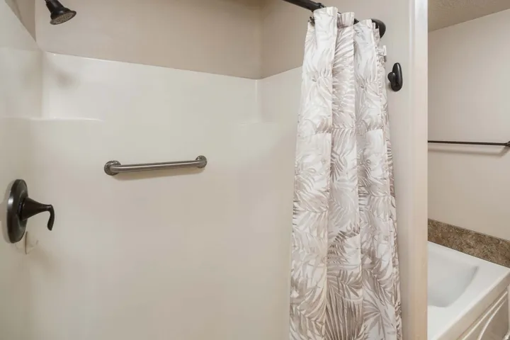 Bathroom with a shower with shower curtain