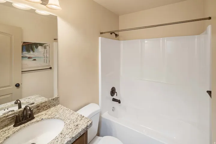 Full bathroom with vanity and bathtub / shower combination