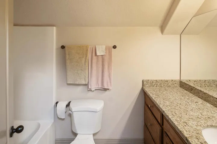 Bathroom featuring vanity and a textured ceiling