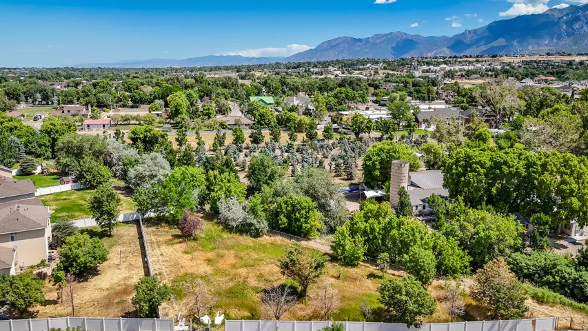 Aerial perspective of suburban area with a mountainous background