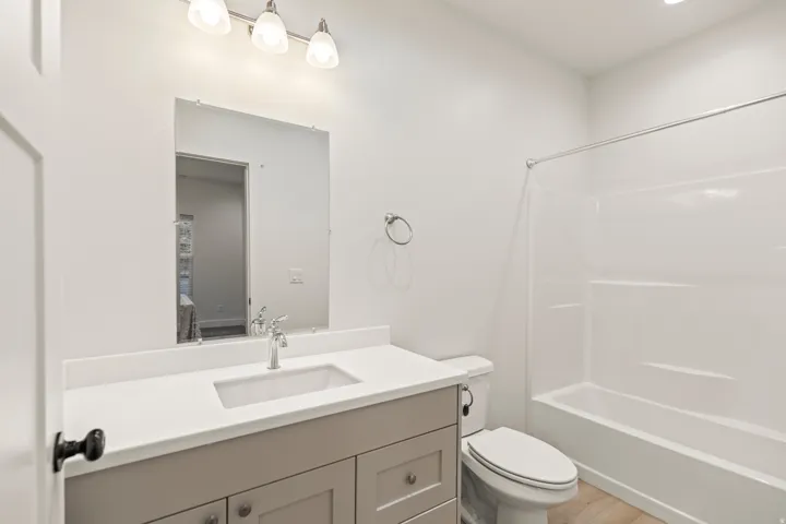 Bathroom with vanity and shower / tub combination