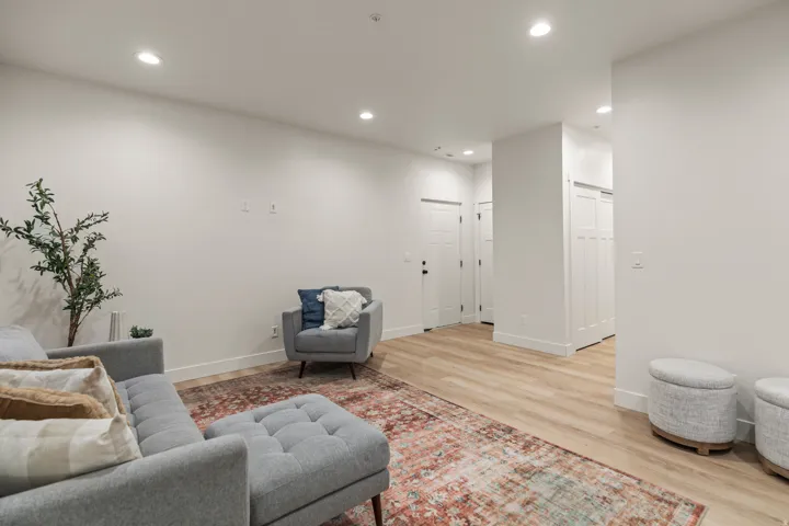 Living area featuring recessed lighting and light wood-style flooring