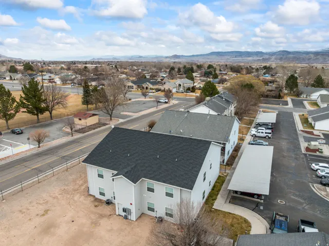 Aerial perspective of suburban area with a mountain backdrop