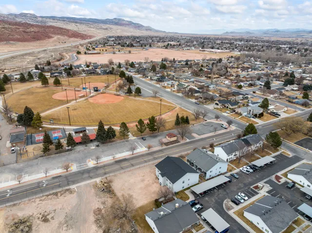 View of property location with a mountain backdrop and nearby suburban area