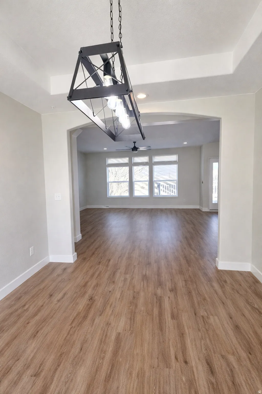Spare room featuring ceiling fan, light wood-style flooring, and recessed lighting
