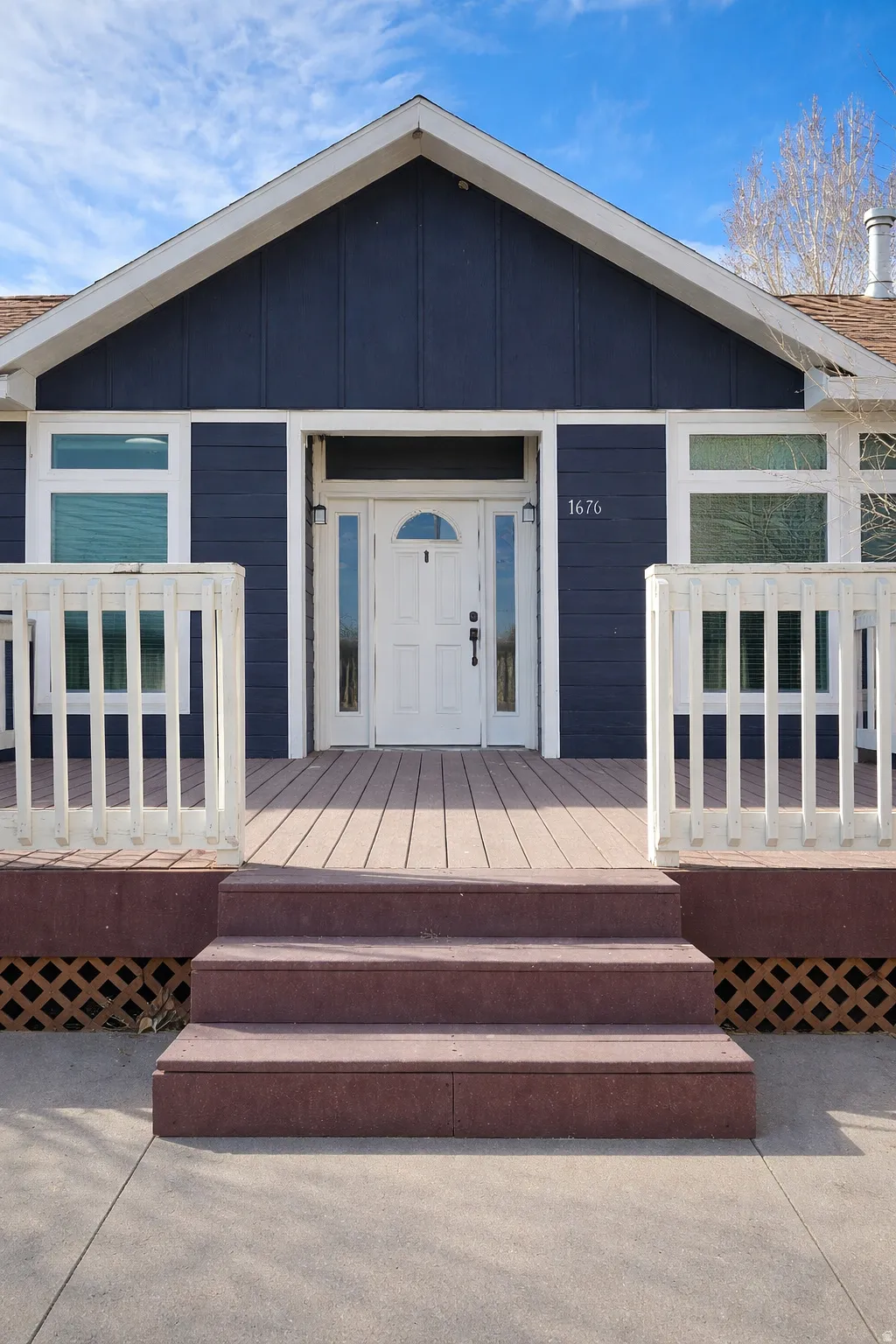 Doorway to property with a deck