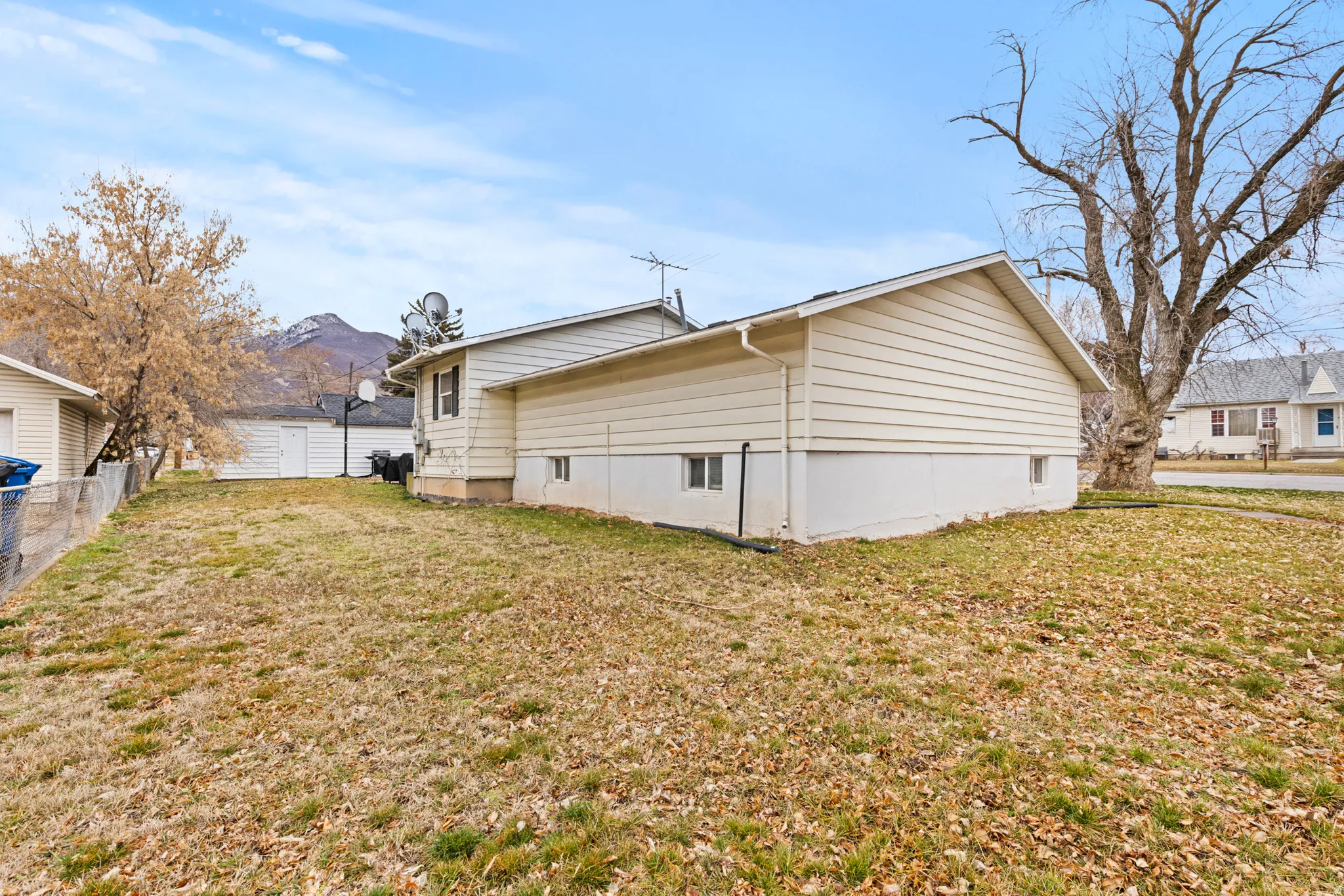 View of side of property with a mountain view