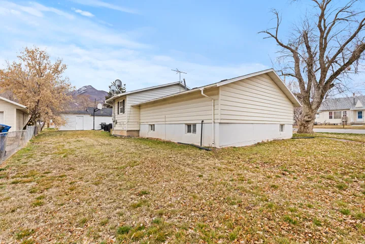 View of side of property with a mountain view