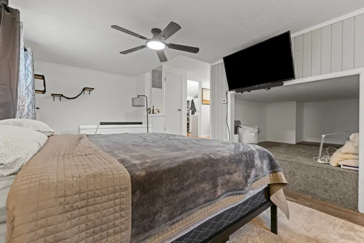 Bedroom featuring a ceiling fan