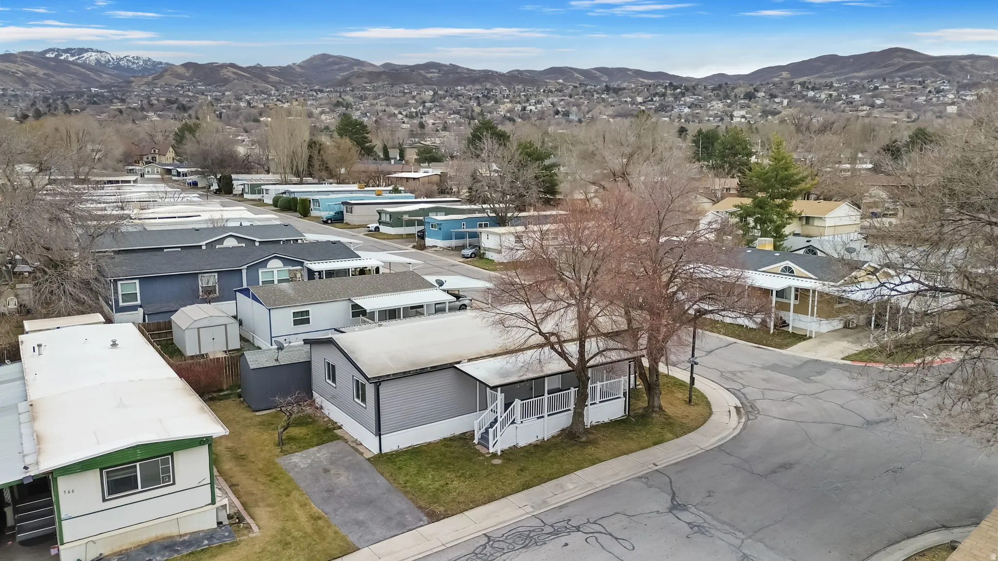 Aerial view of residential area featuring a mountainous background