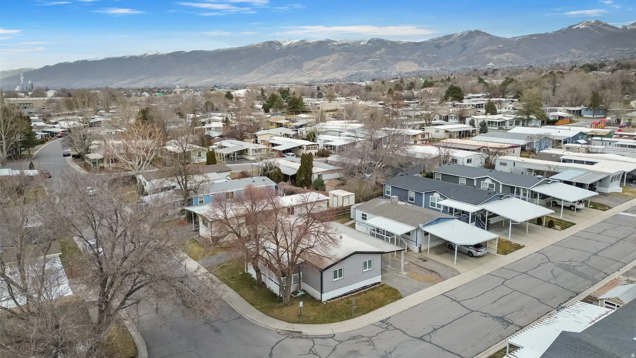 Aerial view of residential area featuring a mountainous background