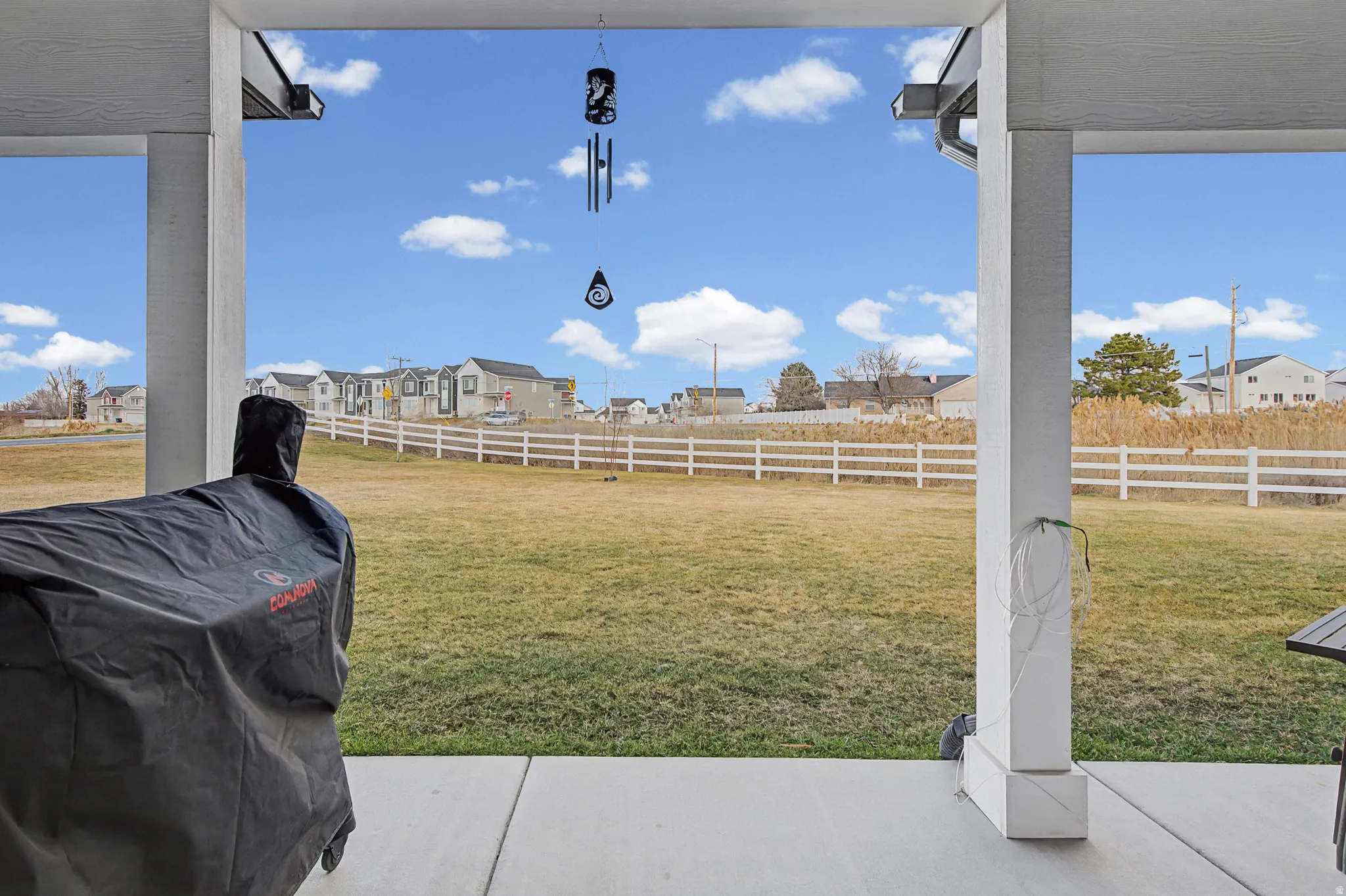 Back door patio view of the walking/biking trails along the fence-line