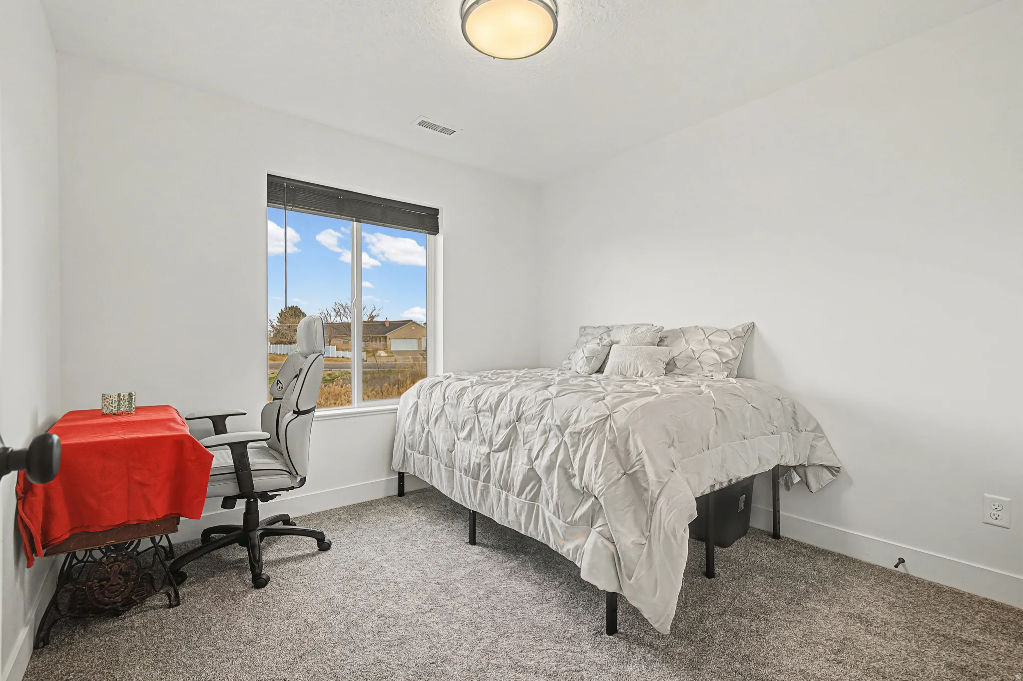 Carpeted guest bedroom #1