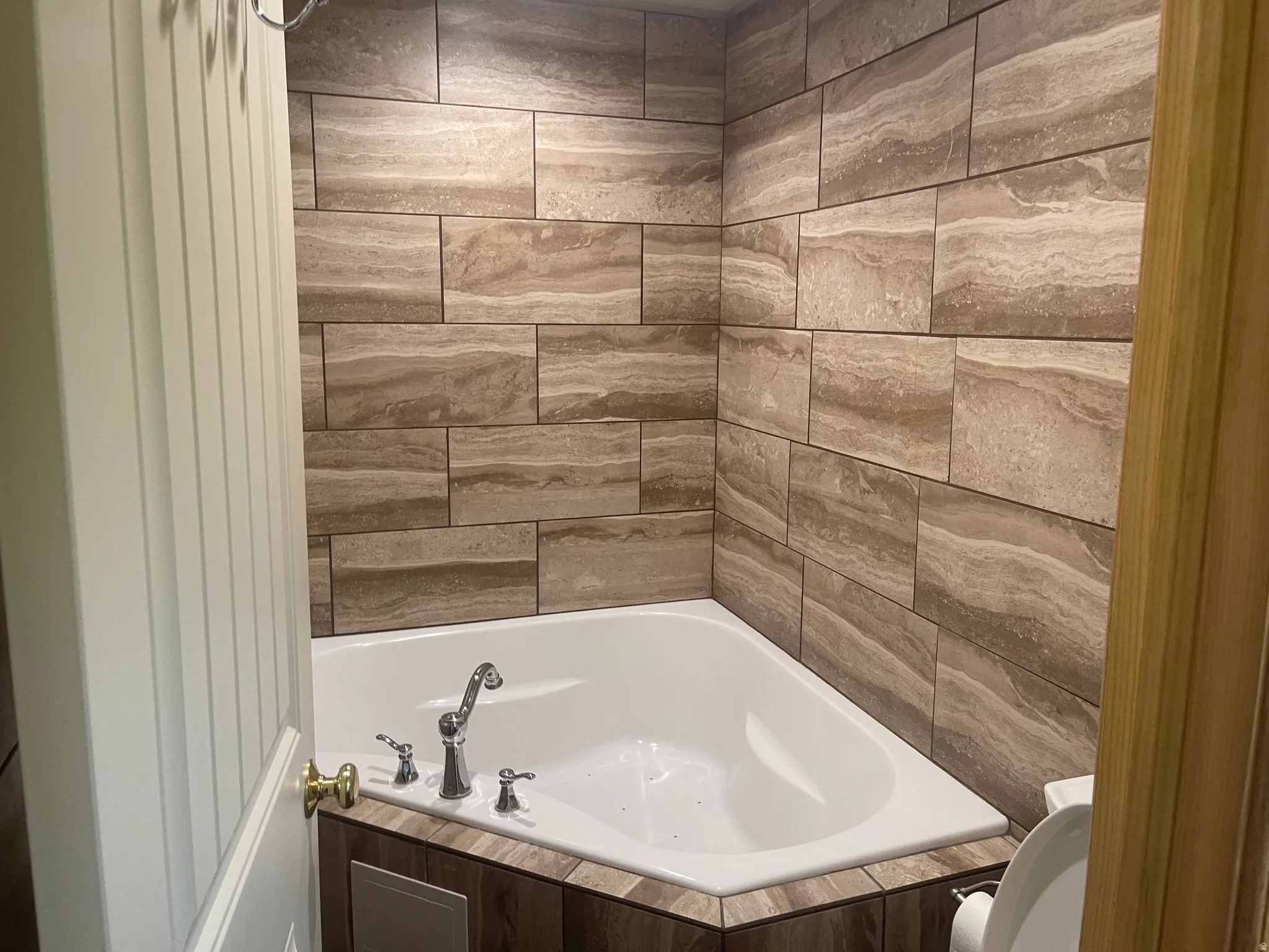 Full bath with tiled bath