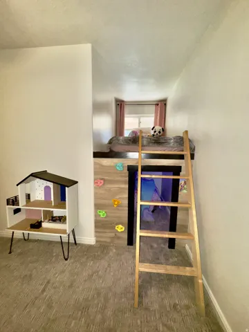 Carpeted bedroom with baseboards
