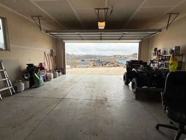 Garage featuring a mountain view and a residential view