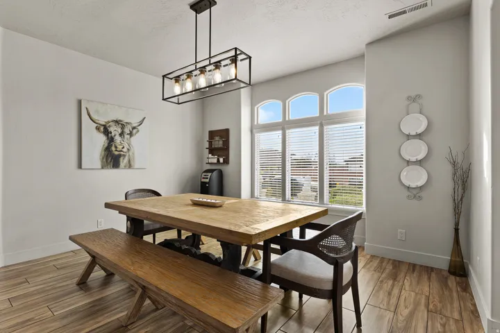 Dining area with wood finish floors and a textured ceiling