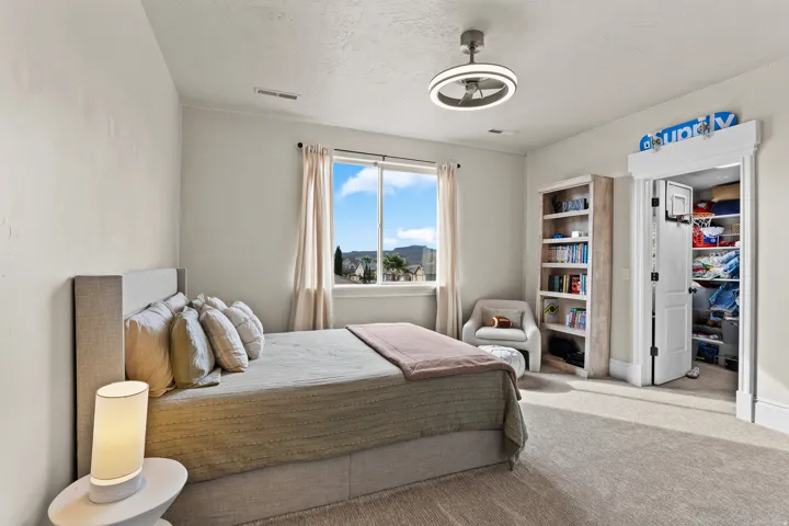 Carpeted bedroom with a textured ceiling