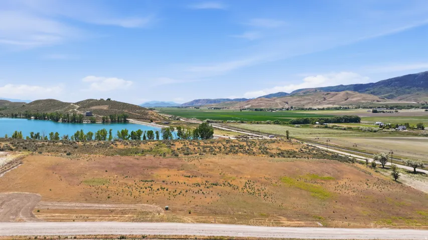 Expansive land parcel featuring open fields and distant hills