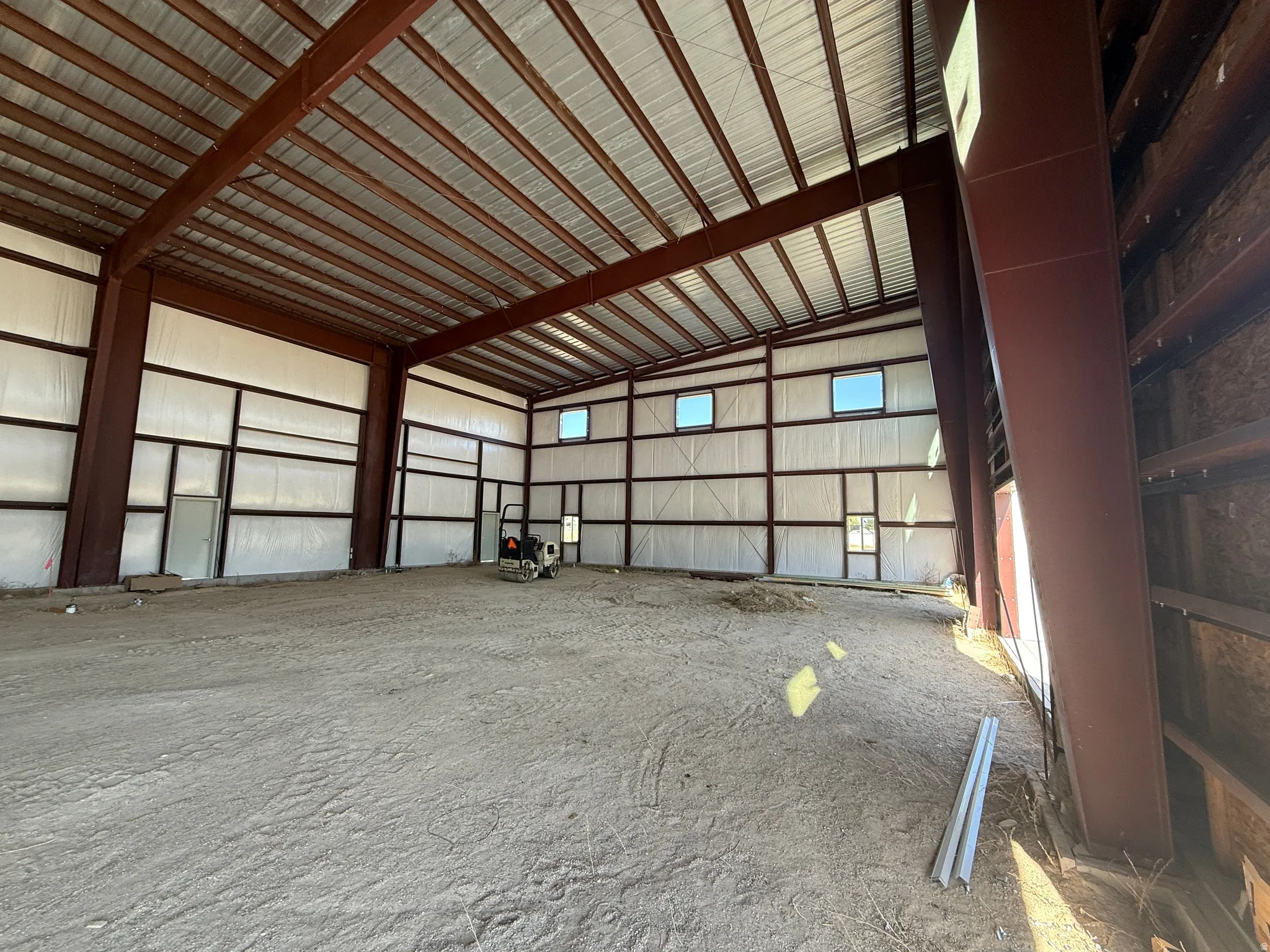 Garage featuring metal wall