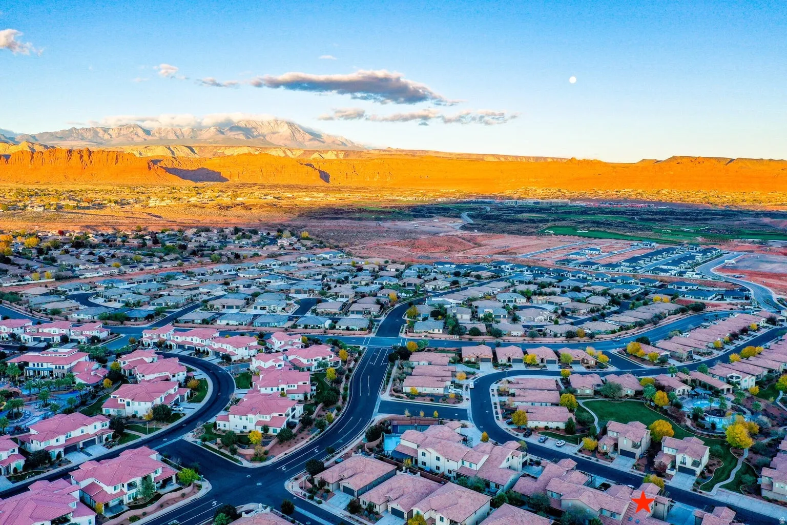 Aerial view of residential area with a mountainous background