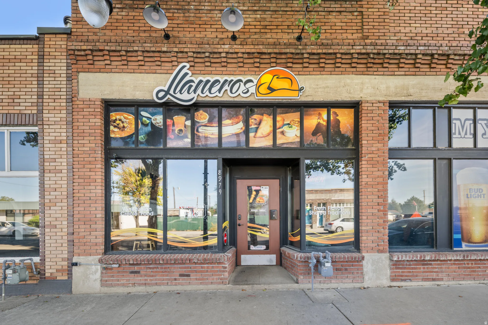 View of exterior entry with brick siding