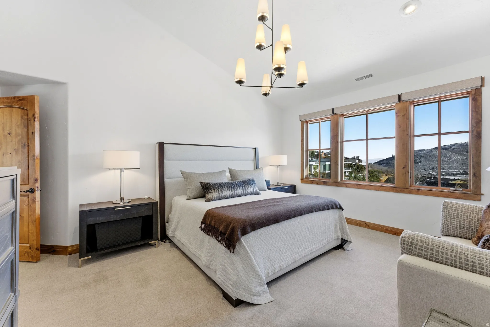Bedroom featuring a contemporary chandelier, vaulted ceiling, and recessed lighting