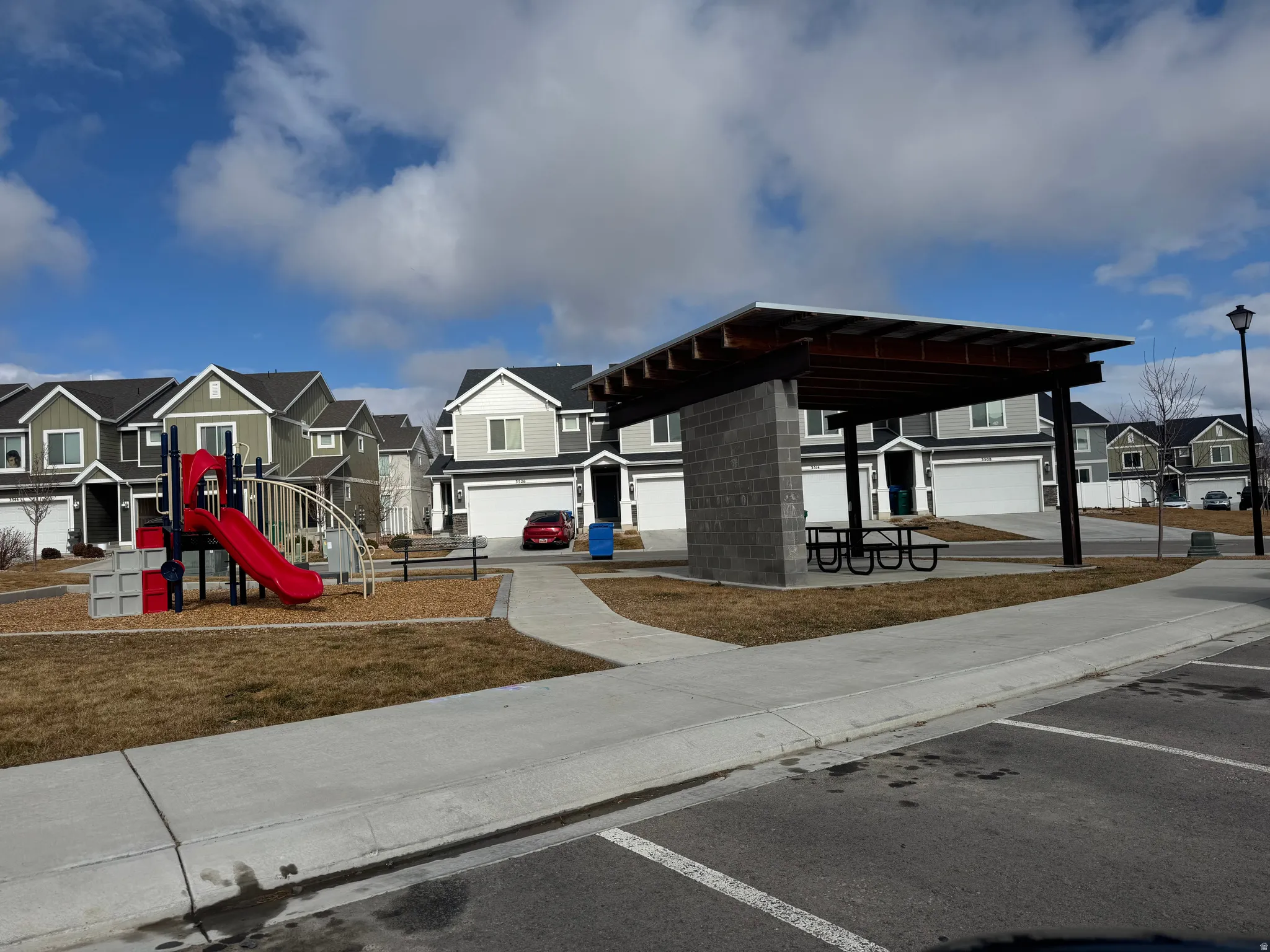 Community playground featuring a residential view
