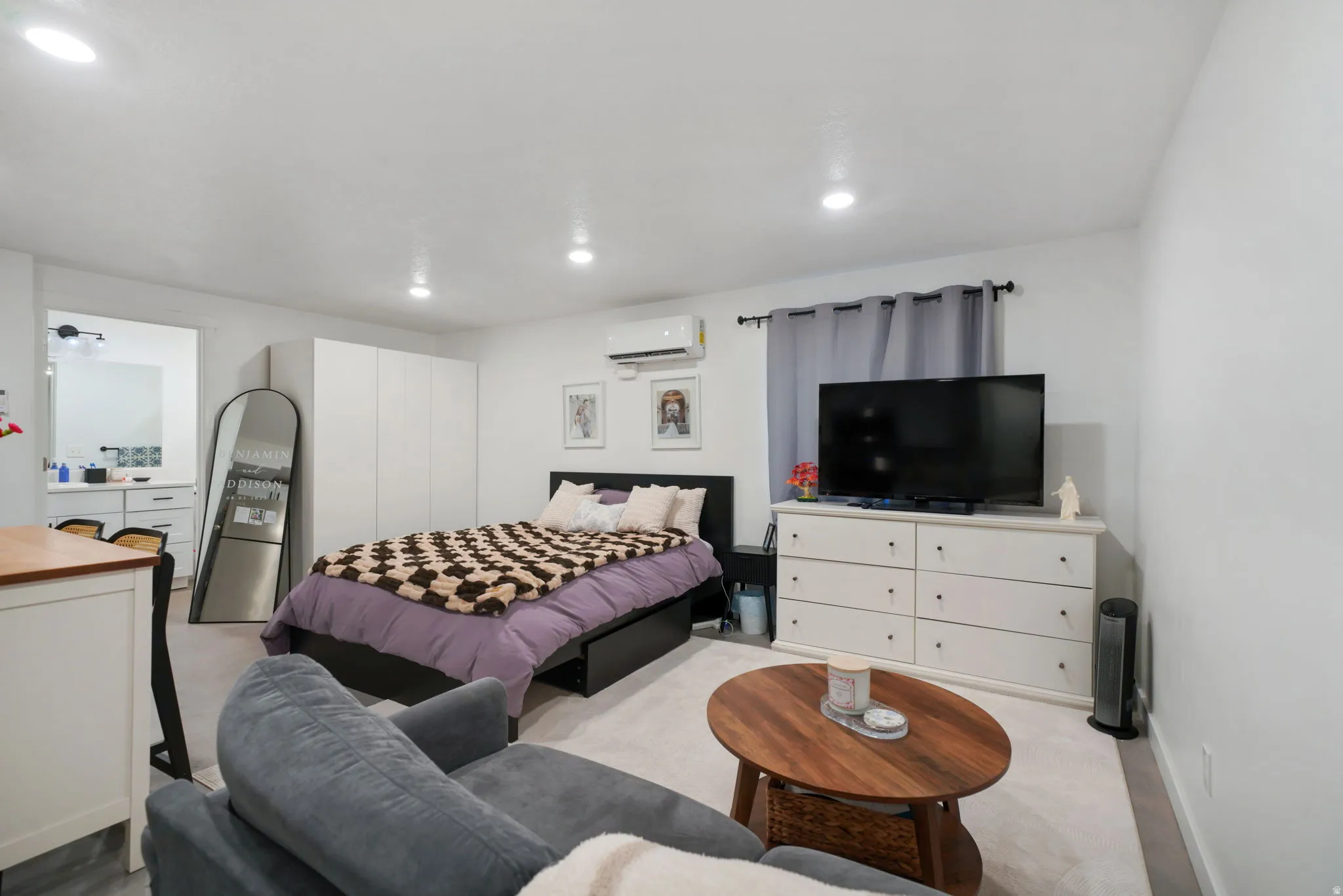 Bedroom featuring recessed lighting, a mini split for heating / cooling, and carpet floors