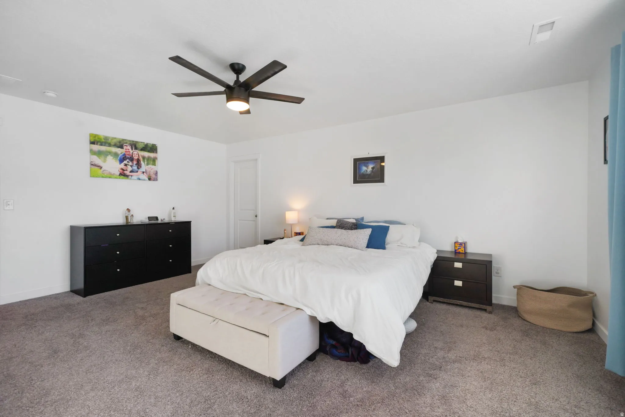 Bedroom with carpet flooring and a ceiling fan