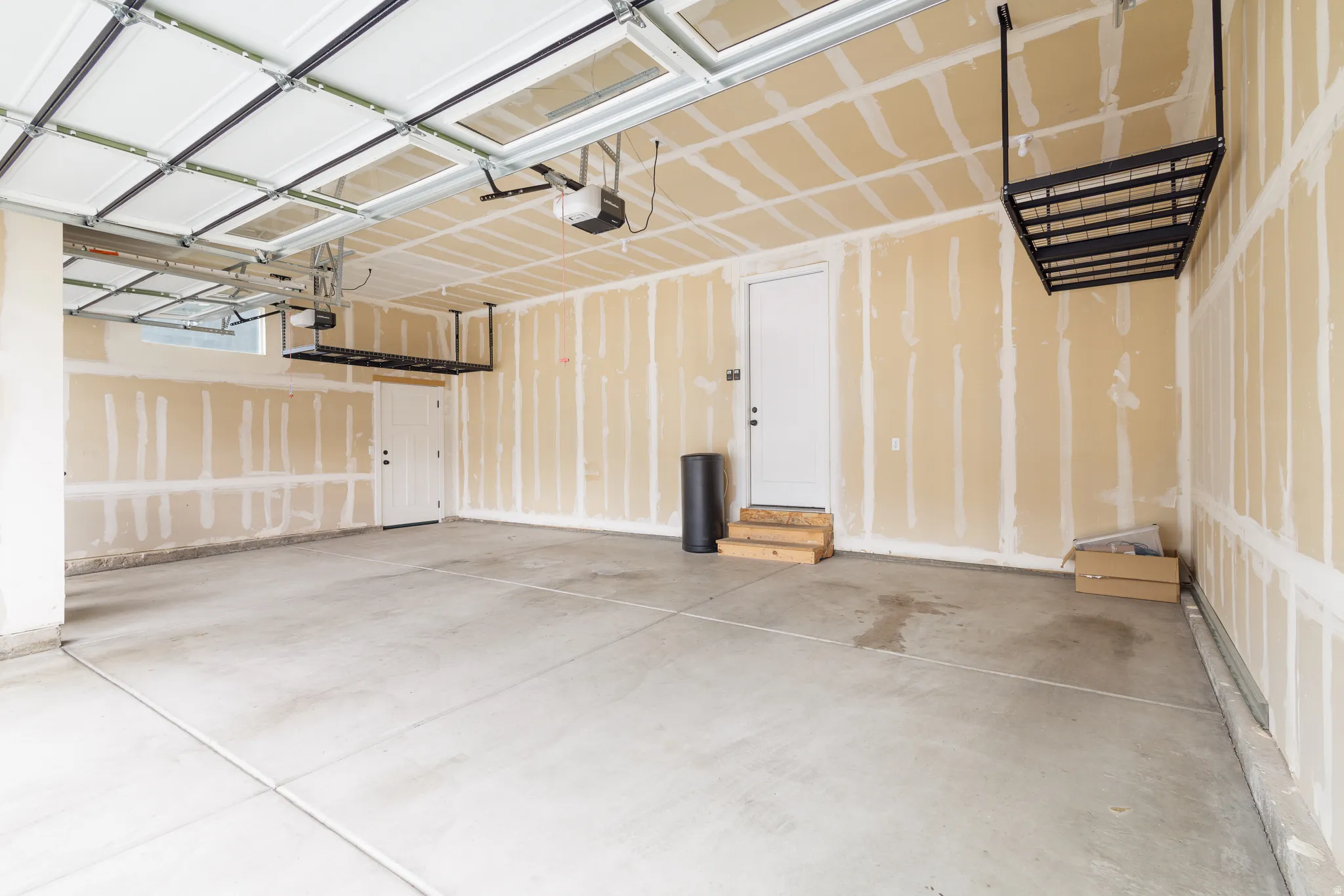 Garage featuring a garage door opener