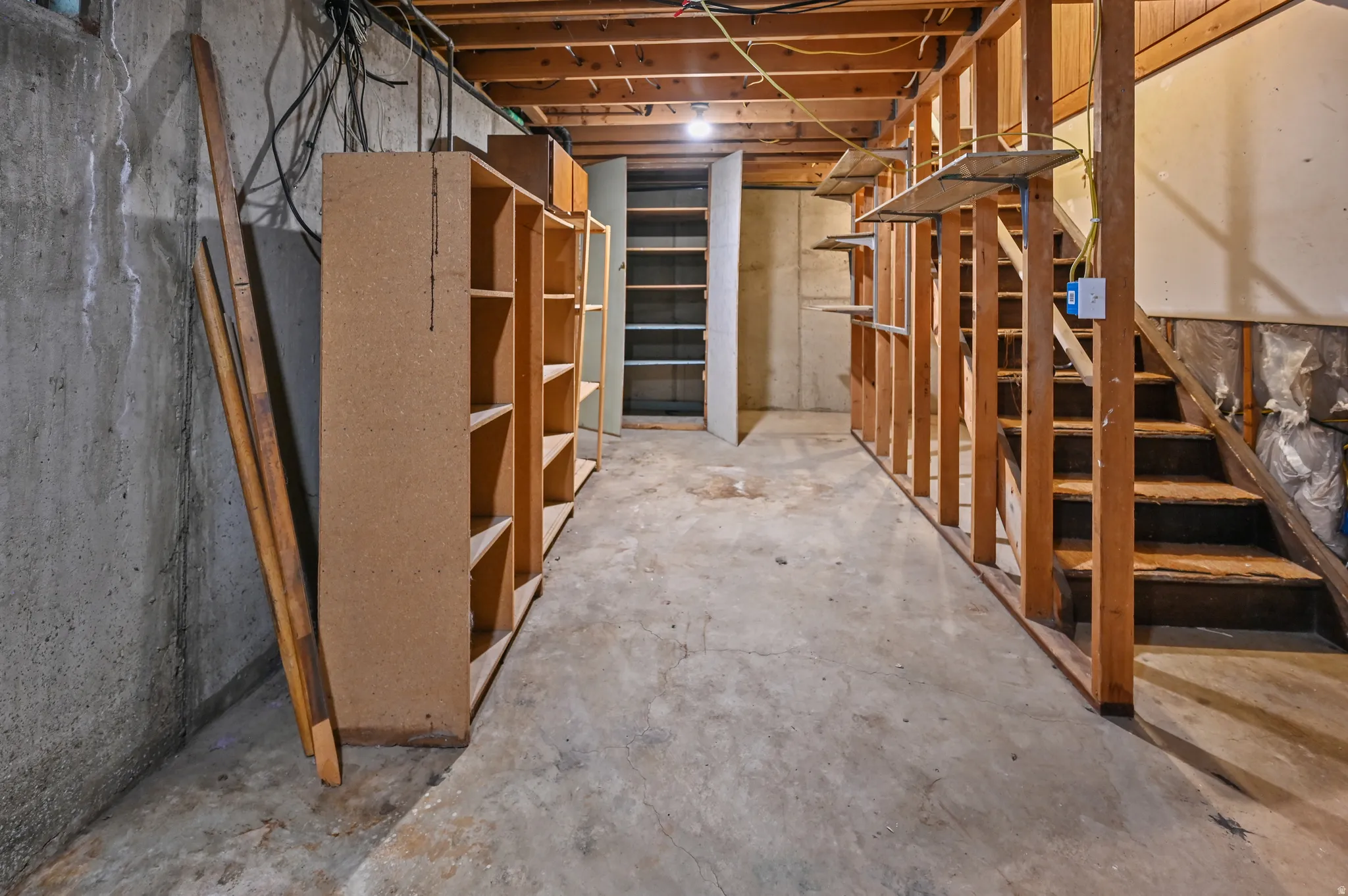 Unfinished basement with stairway