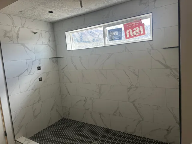 Bathroom featuring a stall shower