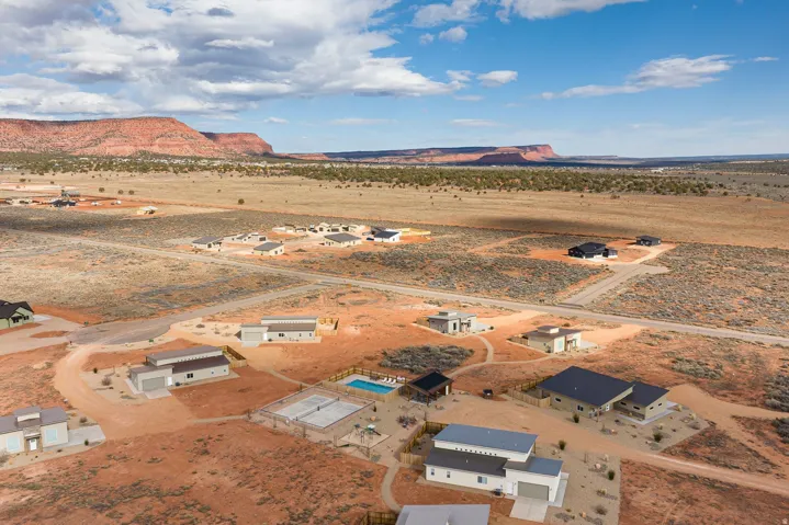 Aerial view of sparsely populated area with a desert landscape and nearby suburban area