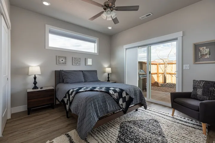 Bedroom with access to outside, wood finished floors, recessed lighting, and a ceiling fan