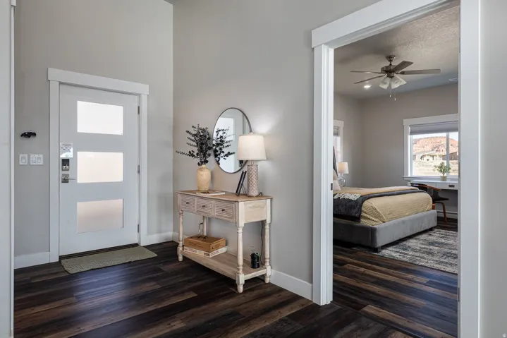 Foyer with dark wood-type flooring and a ceiling fan