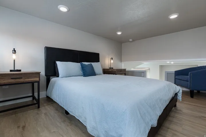 Bedroom featuring light wood-type flooring and recessed lighting
