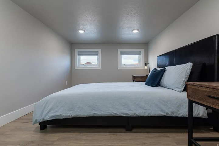 Bedroom featuring a textured ceiling and light wood-style floors