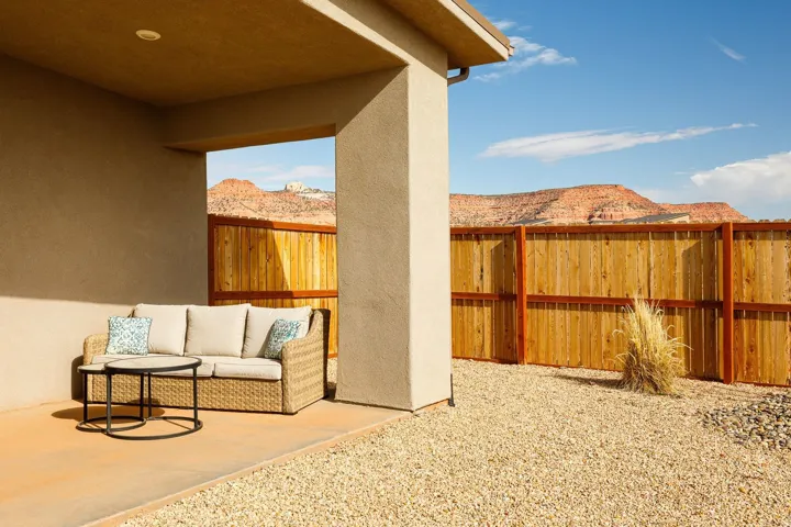 Fenced backyard featuring a patio area and outdoor seating