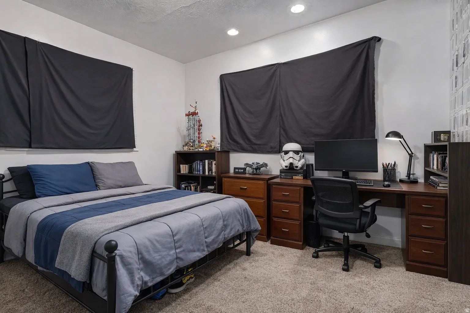 Bedroom with light carpet and recessed lighting