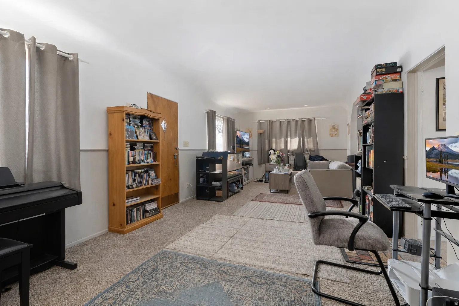 Office with light carpet and baseboards