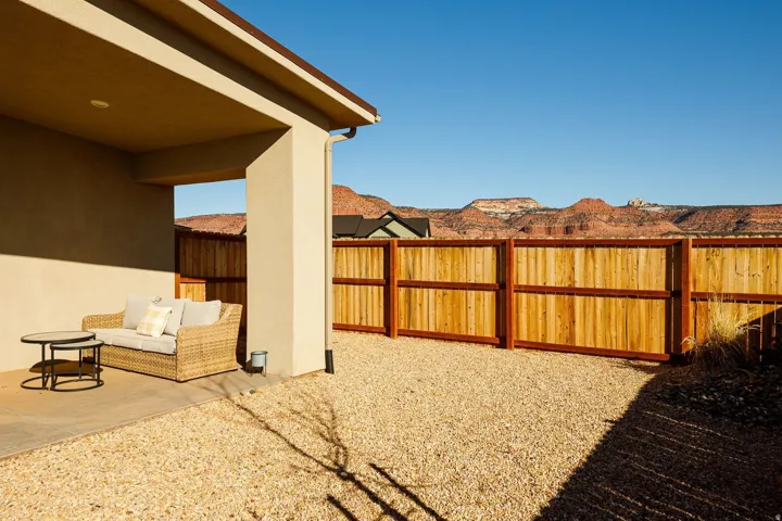 Fenced backyard featuring a patio area