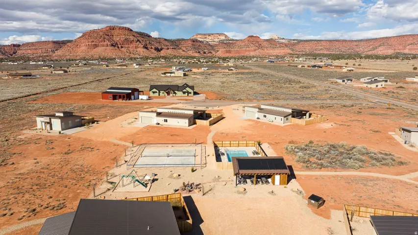Aerial view of residential area featuring mountains
