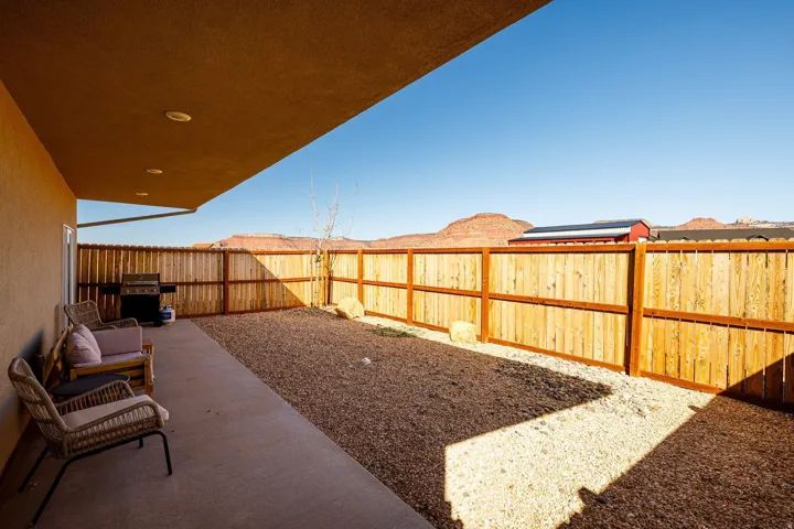 Fenced backyard featuring a patio area